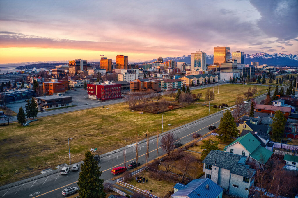 An aerial view of a sunset over Downtown Anchorage, Alaska in Spring